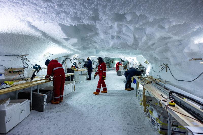 Ice Core Drilling In Greenland, Scientists at the East Greenland Ice-Core Project (EastGRIP) work in the underground science trench at EastGRIP camp on July 28, 2022